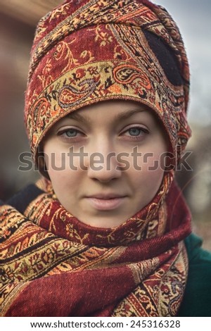 Beautiful young woman wearing scarf. Outdoor fashion portrait. /Scarf against the cold / Beautiful young woman wearing scarf. Outdoor fashion portrait.