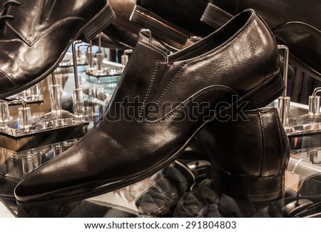 Set of black and brown mens luxury shoes in the store