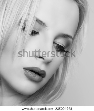 beautiful young woman with perfect skin in black and white