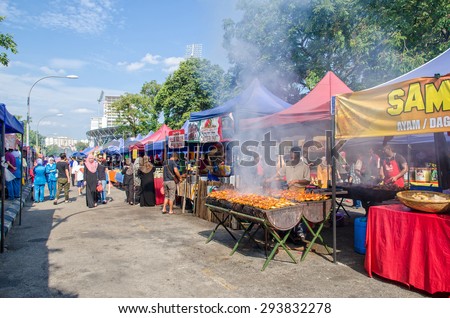 Kuala Lumpur,Malaysia - July 5, 2015: People seen walking and buying foods around the Ramadan Bazaar.It is established for muslim to break fast during the holy month of Ramadan.