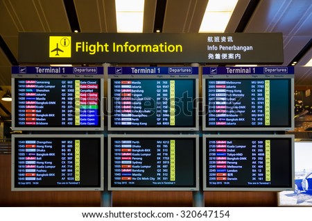 Singapore - September 16,2015 :Arrival Departure Board showing departing flights in Changi Airport, Singapore.