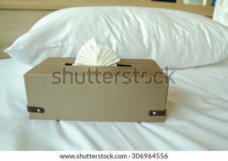 Tissue box on bed
