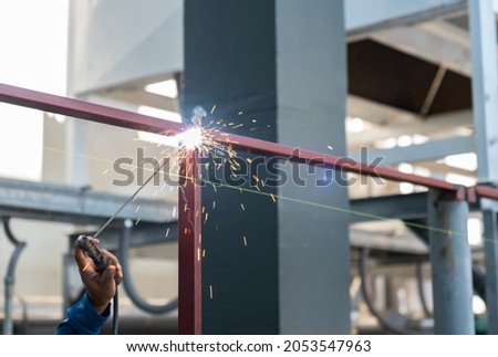 Similar – Image, Stock Photo Unrecognizable welder in hardhat with welding hose in garage