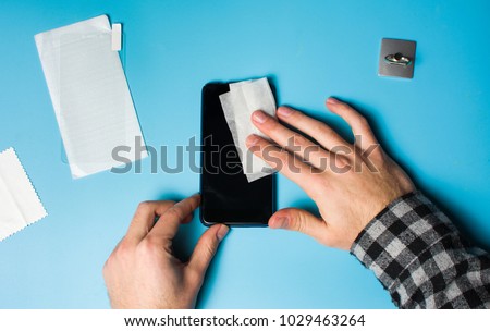 Similar – Image, Stock Photo Hand cleaning a phone screen with wet antibacterial wipes to avoid virus contamination.