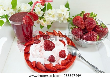 Strawberry dessert, homemade juice and fresh strawberries served on the decorated plate