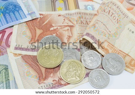 Greek old currency drachma and euro banknotes on white background