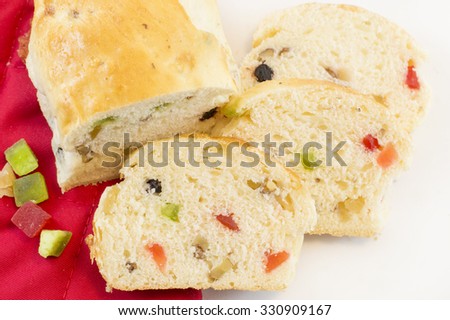 Homebaked colorful fruit bread with various dry fruits on white background