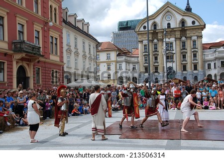 LJUBLJANA, SLOVENIA - AUGUST 24, 2014: Runaway slave on a slave market in ancient Roman city by members of Slovene Historical Society Poetovio at celebration of 2000 years of foundation of Emona.