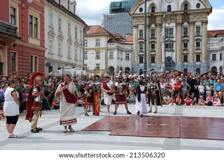 LJUBLJANA, SLOVENIA - AUGUST 24, 2014: A slave for sale at auction on a slave market in ancient Roman city by members of Slovene Historical Society Poetovio at celebration of 2000 years of Emona.