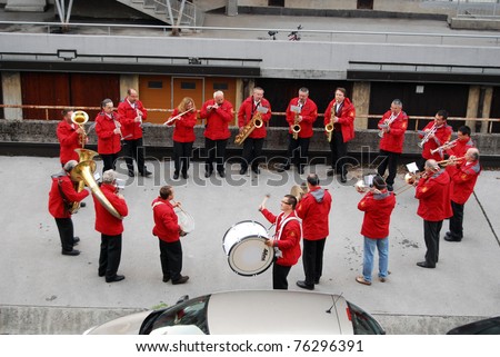 LJUBLJANA, SLOVENIA - MAY 1: Wake-up call brass band play early in the morning on Workers\' Day on May 1, 2011 in Ljubljana, Slovenia. International labor day, also known as May Day, is a holiday here.