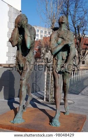 LJUBLJANA, SLOVENIA - MARCH 17: Modern sculpture of Adam and Eve, ashamed and banished from Paradise, made by contemporary Slovene sculptor Jakov Brdar. Ljubljana, Slovenia, March 17, 2012.
