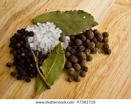 spices - salt, black, fragrant pepper and laurel leaf