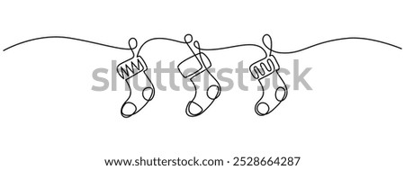 One continuous line drawing of Christmas socks. Festive garland for xmas banner in simple linear style. Elegance logo editable stroke. Doodle vector illustration