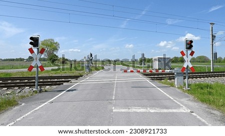 Similar – Image, Stock Photo Level crossing with closed half-barriers on an agricultural road