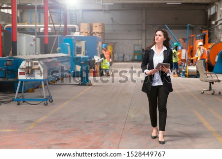 Portrait of factory manager woman using tablet, copy space Stock photo © 