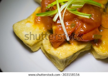 Deep fried tofu in tomato and pepper sauce