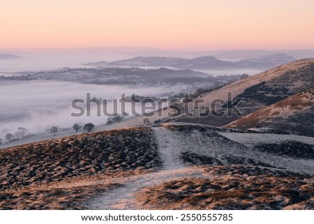 Similar – Foto Bild Schöner Sonnenaufgang im Winter. Landschaft mit dem Meer wird von der aufgehenden Sonne beleuchtet.