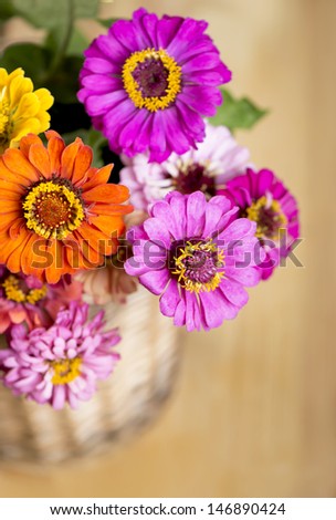 bouquet of beautiful wild flowers in a wattled basket