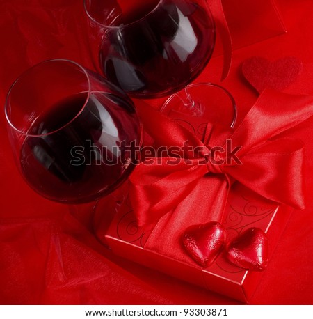Red envelope with tape and sweet in form of heart