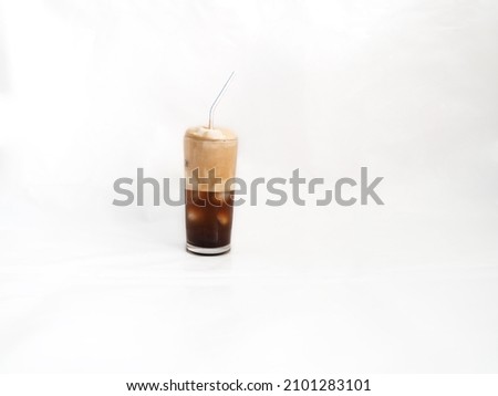 Authentic Greek frappe in 0,2 glass on light background. The coffee was found in 50s in the city of Thessaloniki and has spread worldwide with various variations, Greece, Athens Photo stock © 