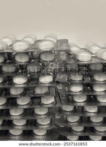 Similar – Image, Stock Photo Stacked tablets in blister pack