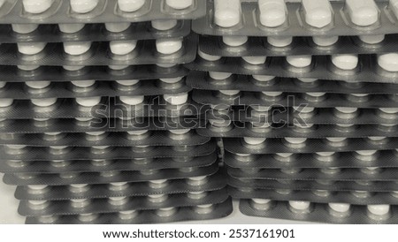 Similar – Image, Stock Photo Stacked tablets in blister pack