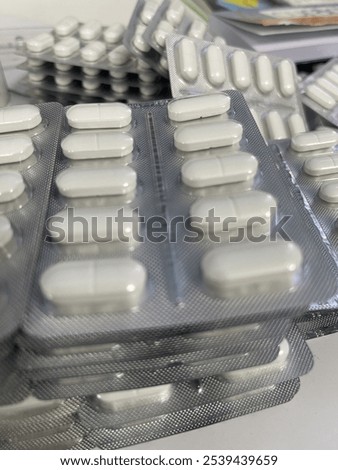 Similar – Image, Stock Photo Stacked tablets in blister pack