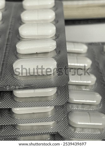 Similar – Image, Stock Photo Stacked tablets in blister pack