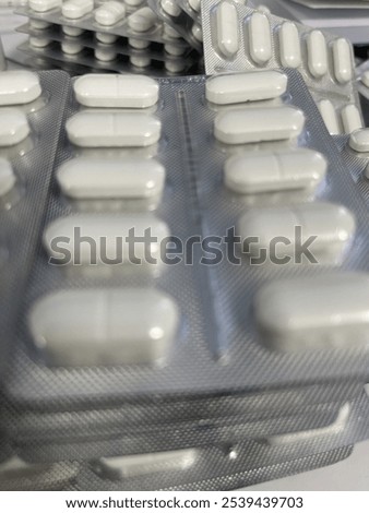 Similar – Image, Stock Photo Stacked tablets in blister pack