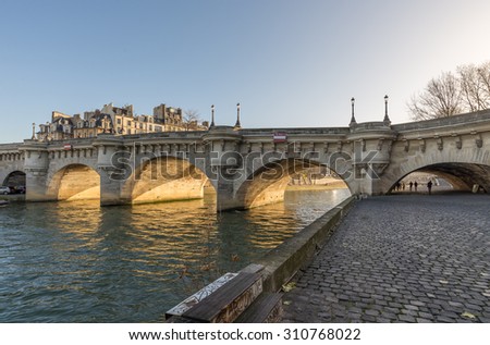 Paris, France - December 20: Pont Neuf, the oldest standing bridge across the river Seine in Paris France; viewed from the west, on December 20, 2013.