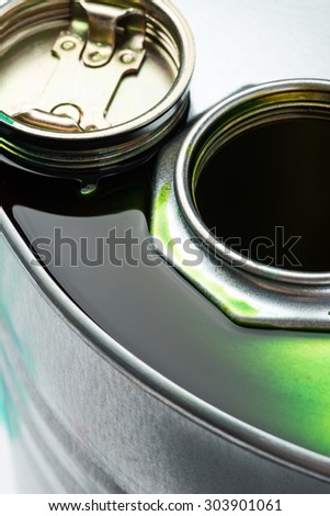 Steel oil and chemical drum over the white background with green pollution liquid, isolated