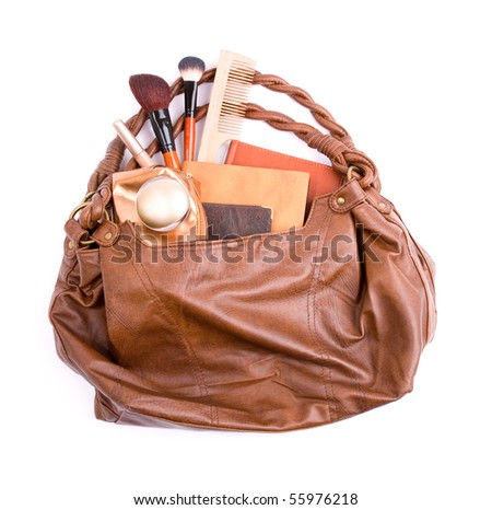 Stylish ladies\' handbag with cosmetics and notebooks