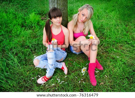 two pretty girls relaxing outdoor