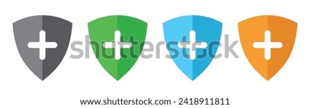 Security shield icon with plus symbol set of four flat design in different colors.