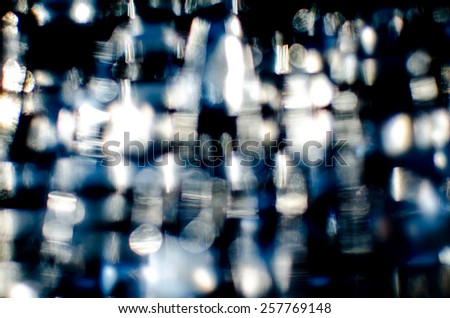 stock photo blur light from glass in low light place colorful with white blue and black shade