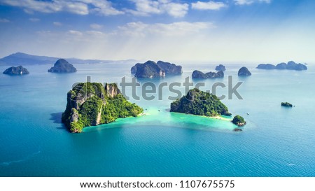 Surrounding Islands of Koh Yao Noi, Phuket, Thailand green lush tropical island in a blue and turquoise sea with islands in the background and clouds with sun beams shining through, drone aerial photo Imagine de stoc © 