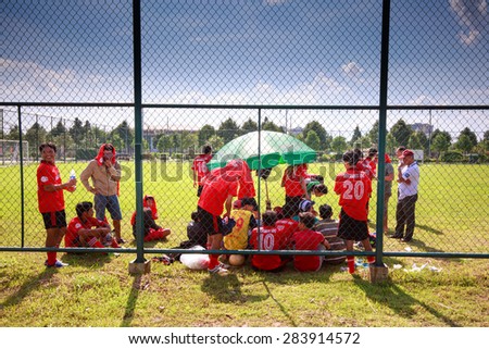 Binh Duong New City, Vietnam - May 30, 2015: break time between match football friendly match between students\' the school in Vietnam. A routine operation in January of school