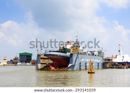 Ho Chi Minh City, Vietnam - June 27, 2015 - a ship repair factory is operating on a river in HoChiMinh City, Vietnam