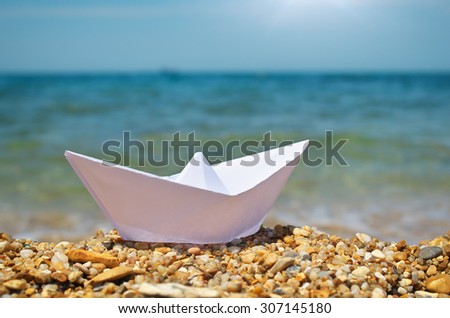 Origami ship on the sea. Element of design.