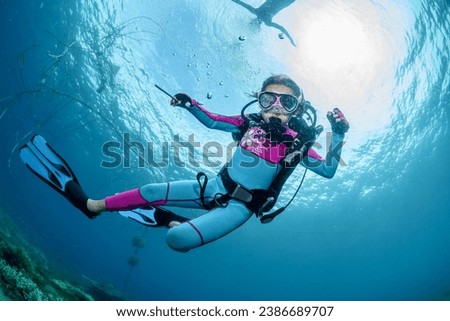 Similar – Image, Stock Photo Girl dives in the pool, in the blue water.