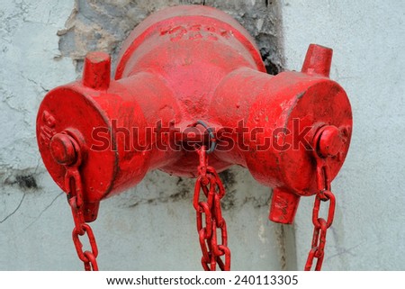 Red Fire Hydrant in the old wall.