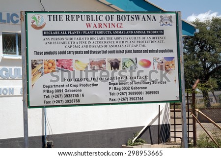 Kazungula, Zambia - April 11, 2015: Warning sign at the border crossing between Zambia and Botswana on Zambezi river. The border crossing at Kazungula.