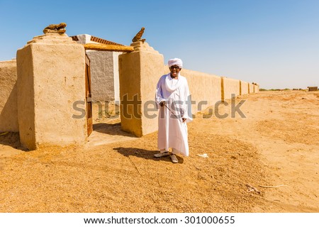 Dongola, Sudan - January 25, 2015: Man is standing in front of the entrance to Charles Bonnet Nubian Village in Dongola, Sudan