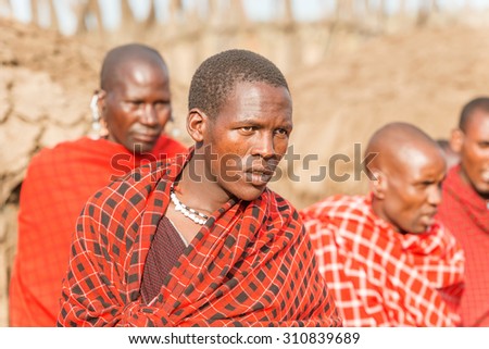 Serengeti, Tanzania - March 12, 2015: Masai with traditional ornaments, review of daily life of local people on March 12, 2015 near Serengeti National Park.