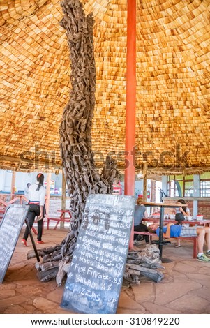 Ngorongoro, Tanzania - March 13, 2015: Carved pillar supports roof in the restaurant in Ngorongoro park in Tanzania