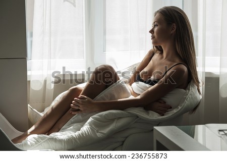 Fashion young woman. Portrait with elegant, pretty, beautiful girl with perfect skin she read the magazine or book at morning .