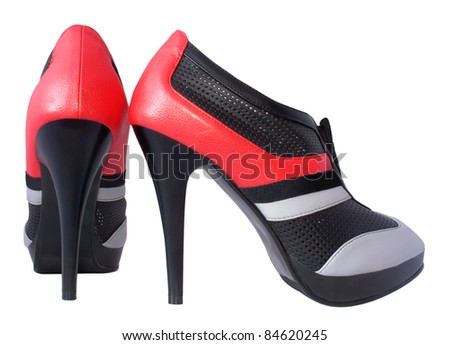 Tri-color (black, red, gray) shoes with high heels. Isolated on white background.