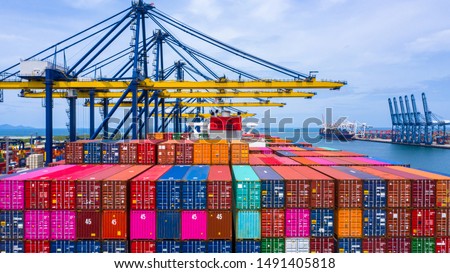 Container ship loading and unloading in sea port, Aerial view of business logistic import and export freight  transportation by container ship in harbor, Container loading Cargo freight ship, Dubai. 商業照片 © 
