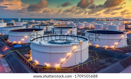 Storage of chemical products like oil, petrol, gas, Aerial view oil storage tank terminal and tanker, petrol industrial zone, Business commercial trade fuel and energy transport by tanker vessel.