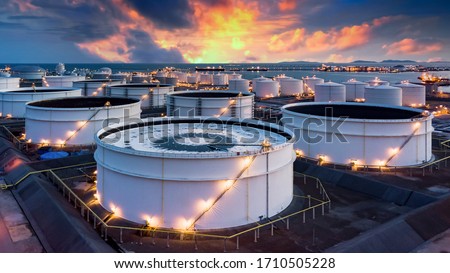 Storage of chemical products like oil, petrol, gas, Aerial view oil storage tank terminal and tanker, petrol industrial zone, Business commercial trade fuel and energy transport by tanker vessel.